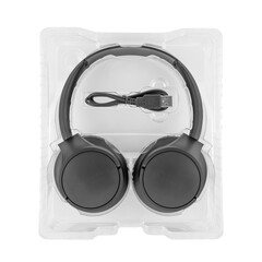close up of black wireless stereo headphones, usb charging cable in plastic carrying case