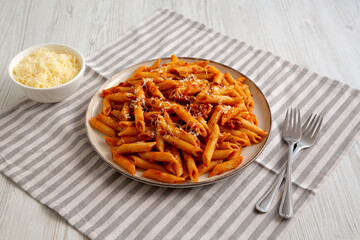 Homemade Pasta Bolognese with Cheese on a Plate, side view.