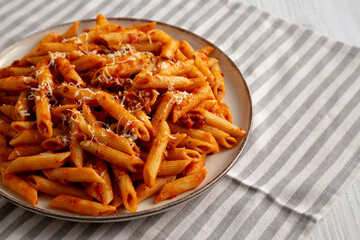 Homemade Pasta Bolognese with Cheese on a Plate, side view. Copy space.