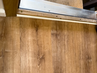 Wood Floor Transition at Metal Door Threshold