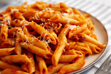 Homemade Pasta Bolognese with Cheese on a Plate, side view. Close-up.