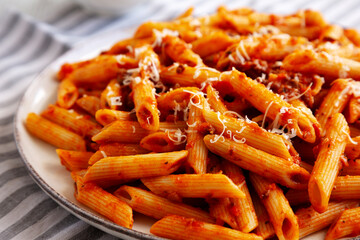 Homemade Pasta Bolognese with Cheese on a Plate, side view. Close-up.