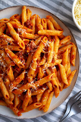 Homemade Pasta Bolognese with Cheese on a Plate, top view.
