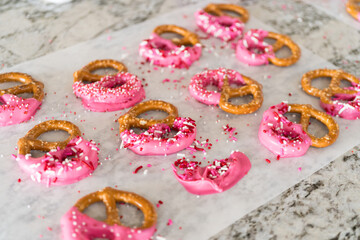 Homemade Gourmet: Delightful Pretzels Adorned with Pink Chocolate and Sprinkles