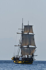 Majestic Sailing Ship in Tranquil Ocean Waters Under a Clear Sky