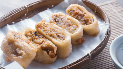 Gohyong is typical chinesse food served with sliced ​​chilies and cuko sauce.