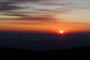 Breathtaking Mountain Sunset Over Scenic Landscape with Colorful glowing sky