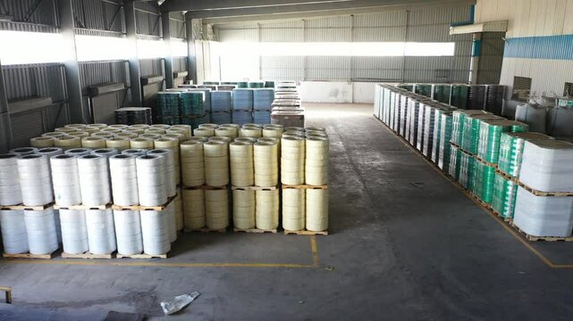 Bhavnagar, Gujarat, India 06 20 2025:  aerial shot of final PET and PP strap stock is neatly arranged in section
