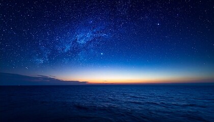 Distant horizon under a rich indigo canopy filled with glowing stars, subtle gradients fading into shadowed space.