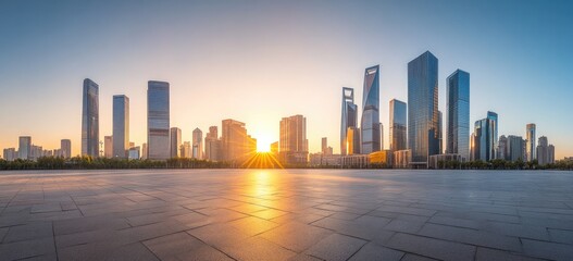 Obraz premium Sunrise over a city's skyline, empty plaza below