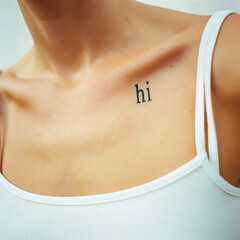 Minimalist Tattoo: 'Hi' on a Woman's Shoulder