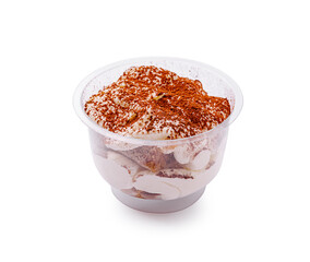 Delicious dessert served in a clear cup with layers and spices