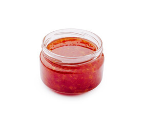 Spicy red sauce in glass jar for cooking and dressing meals