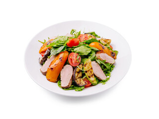 Colorful salad with grilled vegetables and sliced meat on a white plate