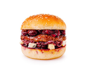 Gourmet burger with cherry jam and cheese on a sesame seed bun