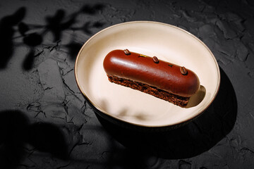 Delicious chocolate dessert served on a minimalist plate in a cozy setting