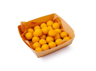 Delicious golden snacks served in a rustic paper tray at a festive gathering