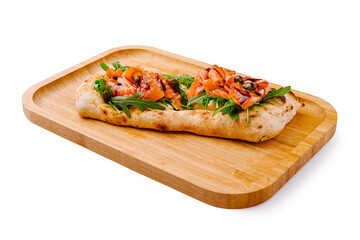 Delicious flatbread topped with shrimp and arugula on wooden tray