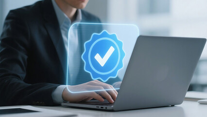 Man using laptop with digital verification check mark graphic