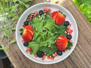 Crystal Ice Plant with strawberry, blue berry and pomegranate salad