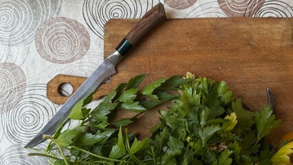 Chopped parsley on cutting board with knife