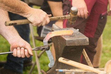 blacksmith working with hammer