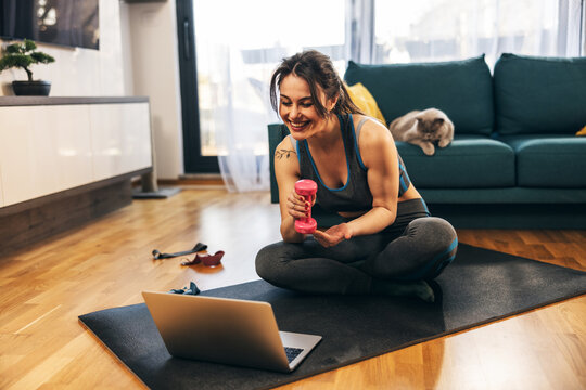 Woman Doing Online Workout At Home - Powered by Adobe