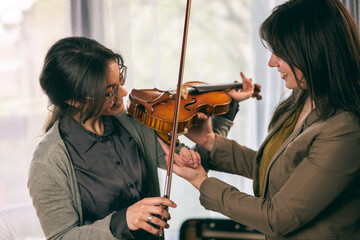 Student Teaching How To Play Violin