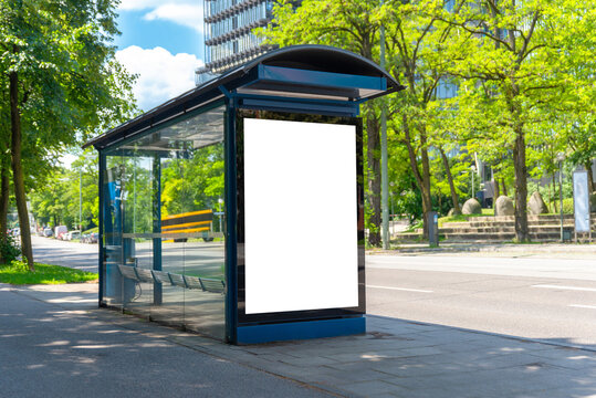 Blank bus stop mockup in sunny urban environment with green trees, ideal for outdoor advertising or city branding campaigns