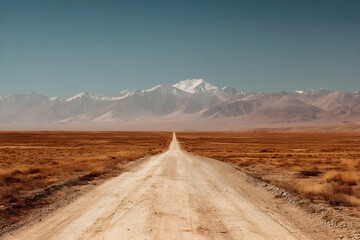 Fototapeta premium Desert road leading to snow capped mountains