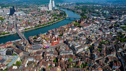 An aerial panoramic view around the old town of the city Basel in Switzerland on a sunny noon in...