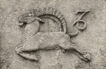Vintage stone carving of  Zodiac - Capricorn or Sea-Goat, a stone relief (No. 12 of the series)