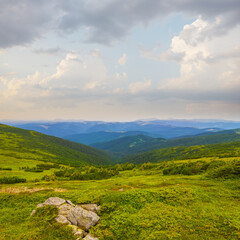 Fototapeta premium beautiful green mountain backbone under blue cloudy sky