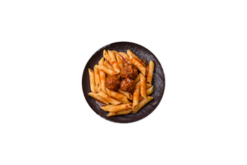 Penne pasta with meatballs in tomato sauce with salt and spices. Italian food penne pasta