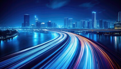 Night cityscape with a curving highway showcasing light trails