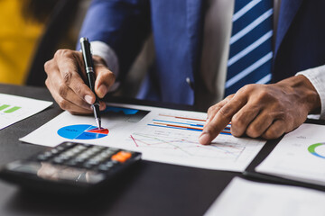 Businessman working financial documents calculating and auditing, analysis of financial figures and...