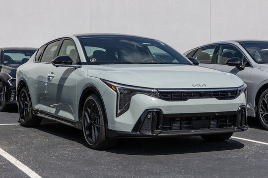 Kia K4 GT-Line Turbo Compact Sedan at a dealership. Kia offers the K4 with a 1.6L Turbocharged 4-Cylinder engine. MY:2025