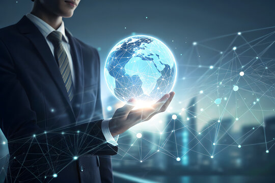 Businessman holding holographic globe representing global technology