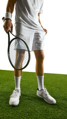 A tennis player, in white attire, holds a racket on a green grass court, preparing for a match. Concept of athletic readiness and sportsmanship on a classic surface.