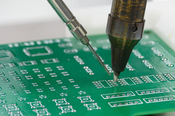 The automatic soldering machine operation with PCB board.
