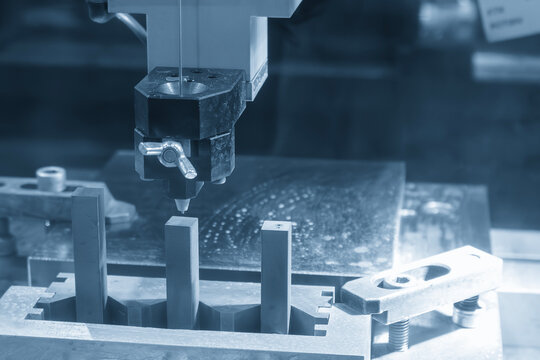 Operation of super drill EDM machine in the light blue scene.