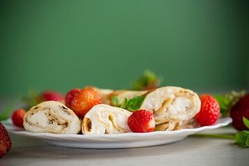 Homemade pancakes with cottage cheese filling and berries