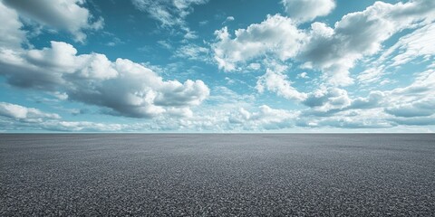 Flat asphalt expanse under a vast cloudy sky