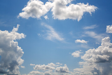 Blue sky and textured clouds framing the edges of the shot, cloud frame against the blue sky,...
