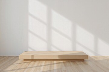 Minimalist interior scene with a light wood platform on a light wood floor against a white wall with natural light creating geometric shadows