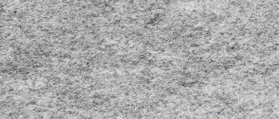 Soft grey felt material. Surface of felted fabric texture abstract background in gray color. High...