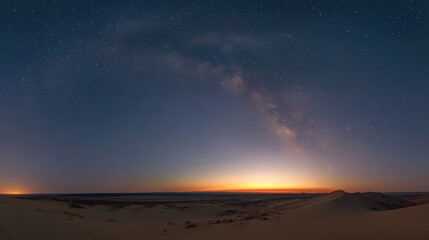 Fototapeta premium Time-lapse of Milky Way rising above isolated desert dune