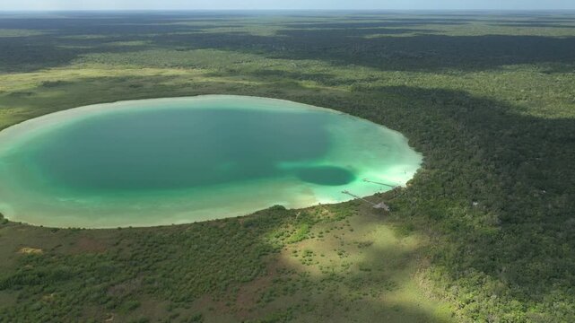 Aerial view of Kaan Luum lagoon, a beautiful hidden gem in the Yucatan Peninsula, Mexico, with its turquoise waters and lush jungle surroundings
