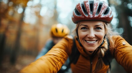 A joyful woman with a helmet rides a bicycle through a vibrant autumn forest, radiating happiness and embodying the spirit of adventure in the beautiful outdoors.
