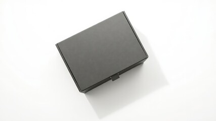 Fototapeta premium Minimalist presentation of a sleek black box against a pristine white background with a modern aesthetic